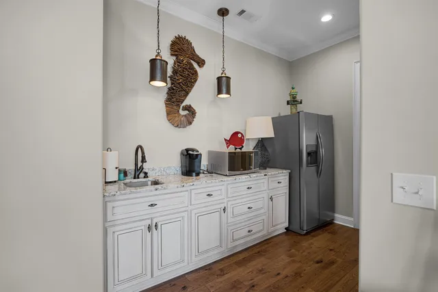 a bathroom with a sink and mirror