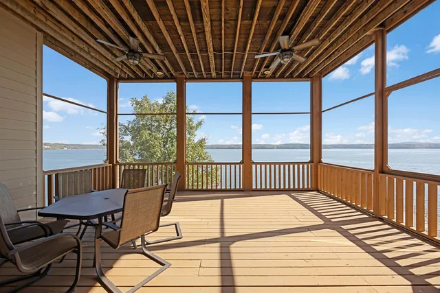 a view of a two chairs in the balcony
