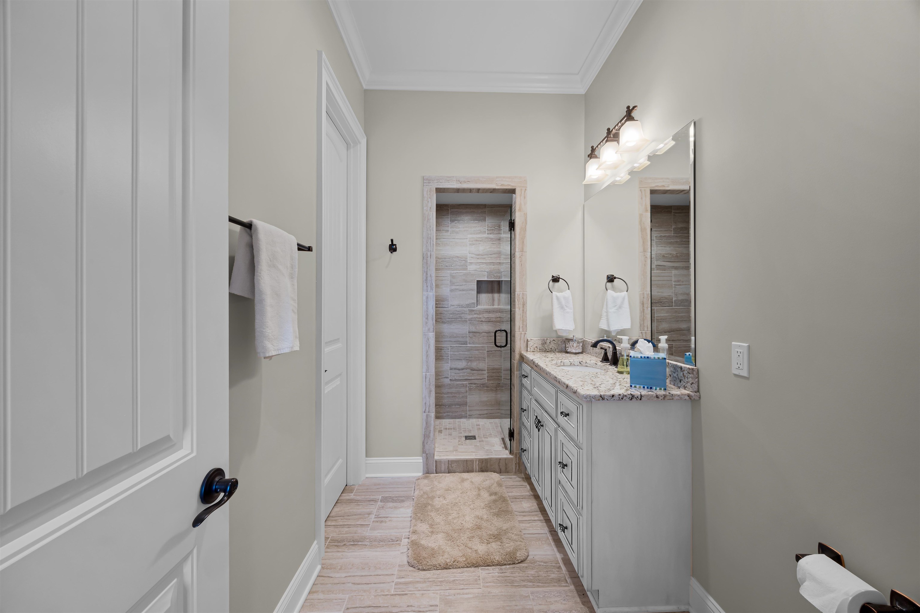 45 Pinnacle Pointe Savannah, TN 38372 - Photo 28 of 30 a bathroom with a double vanity sink a mirror and a shower