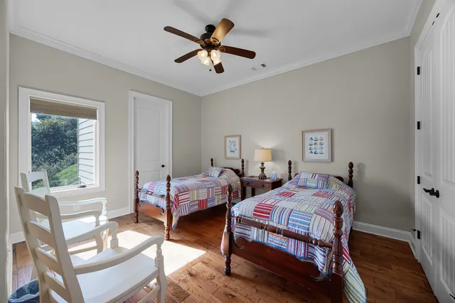 a bedroom with two beds and a table