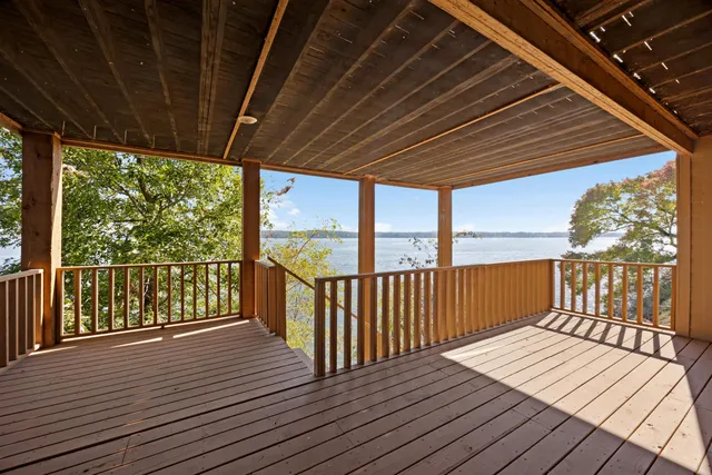a view of balcony with wooden floor