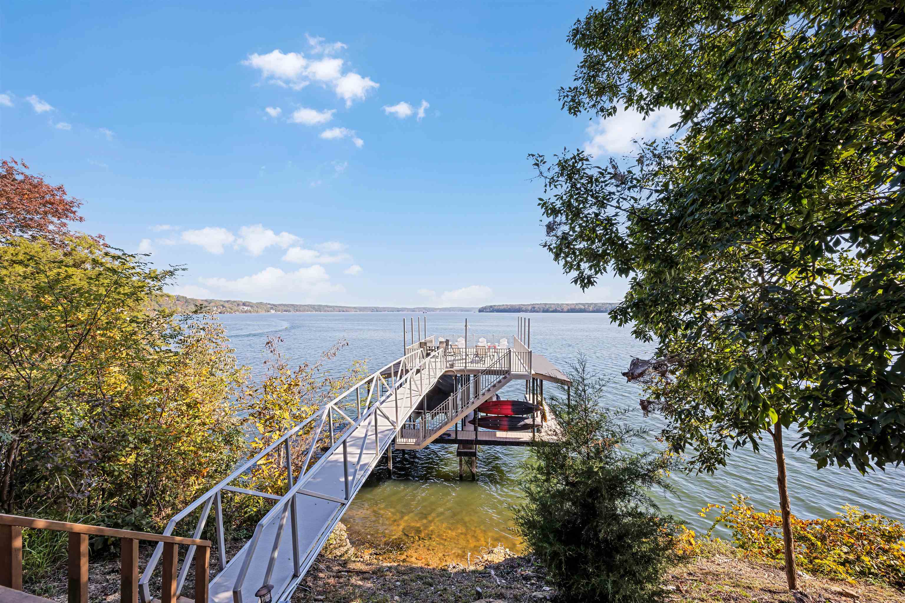 45 Pinnacle Pointe Savannah, TN 38372 - Photo 5 of 30 a view of a balcony with two plants and large trees