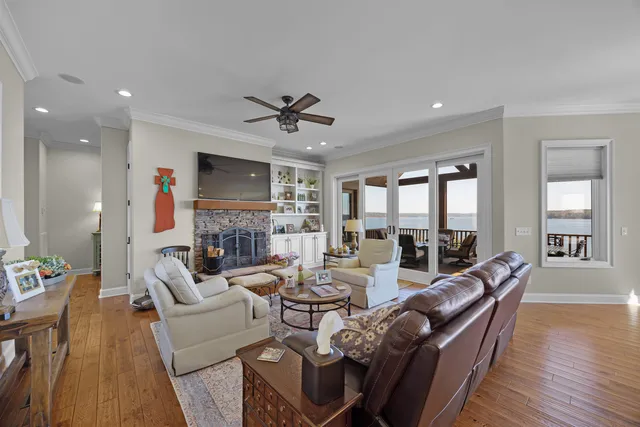 a living room with fireplace furniture and a flat screen tv