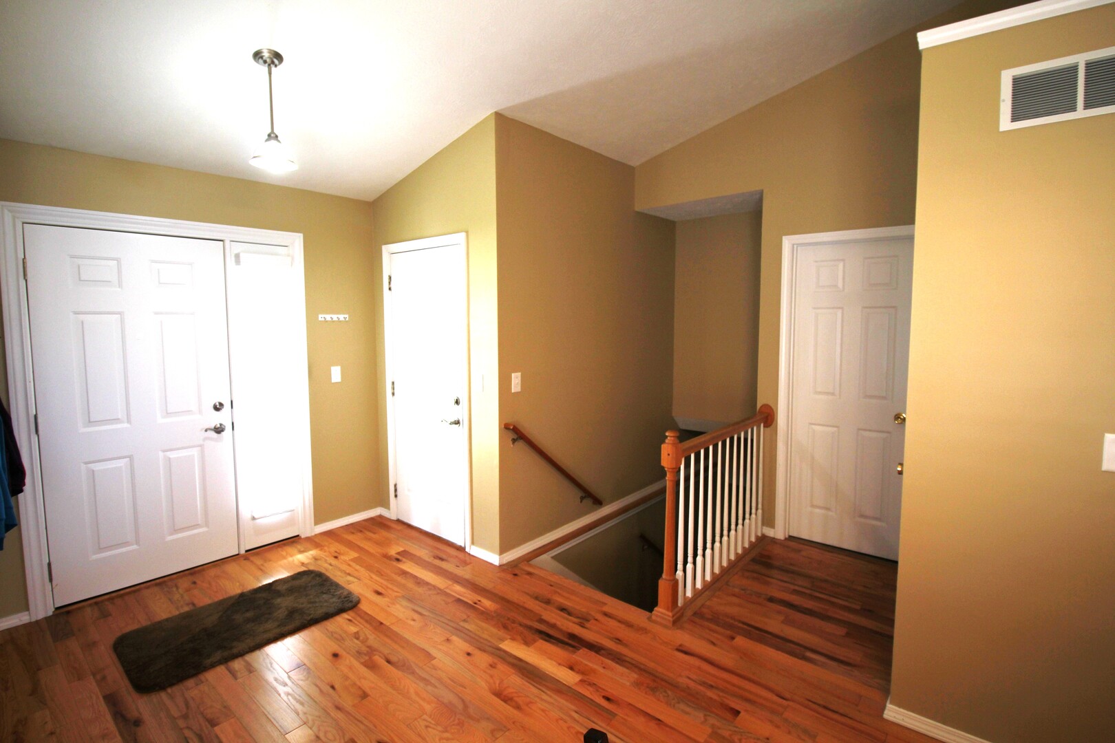 25 Oak Park Road Bloomington, IL 61701 - Photo 4 of 28 a bedroom with a bed and wooden floor