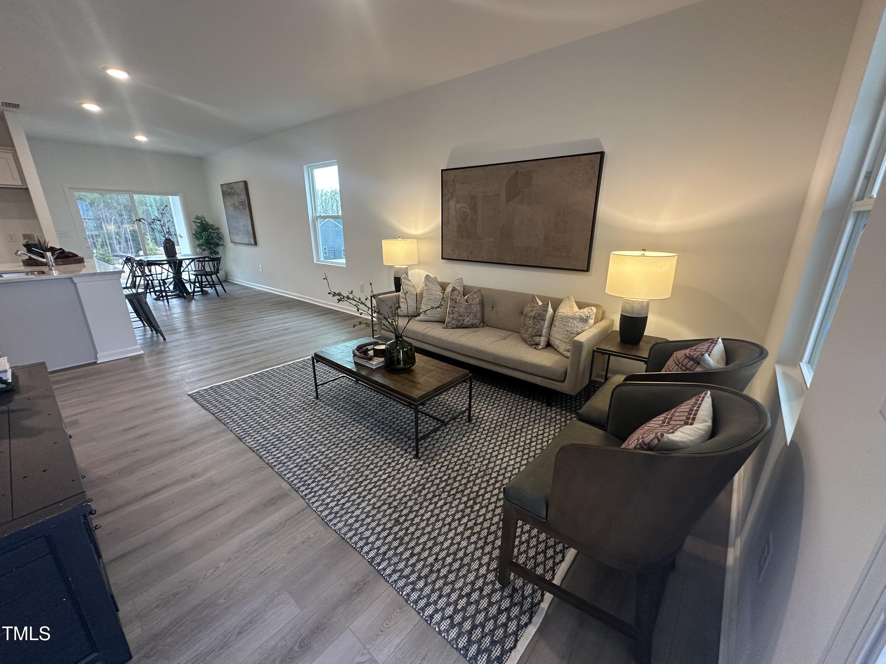 11198 Salers Loop Middlesex, NC 27557 - Photo 15 of 34 a living room with furniture and wooden floor