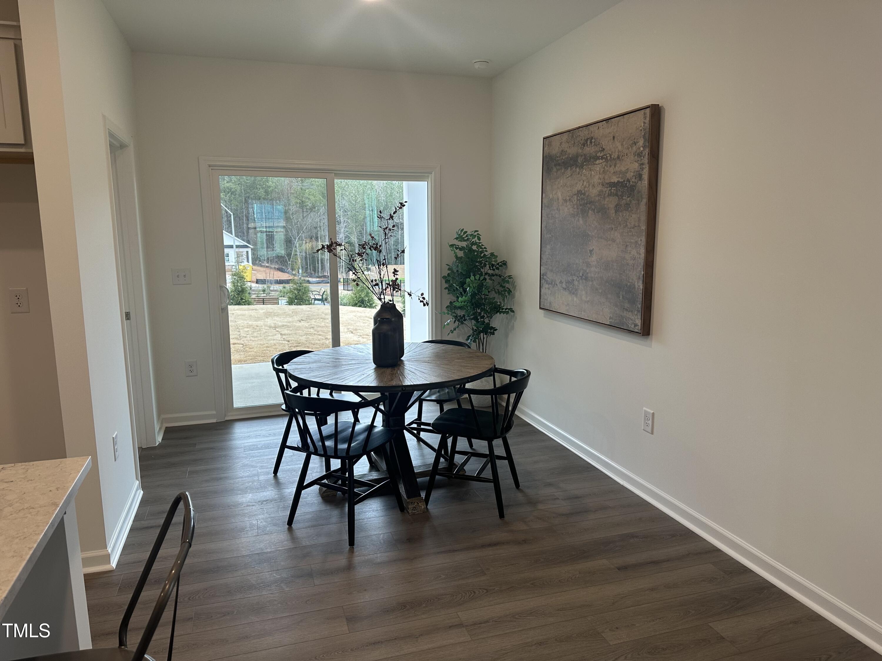 11198 Salers Loop Middlesex, NC 27557 - Photo 19 of 34 a dining room with furniture window and wooden floor
