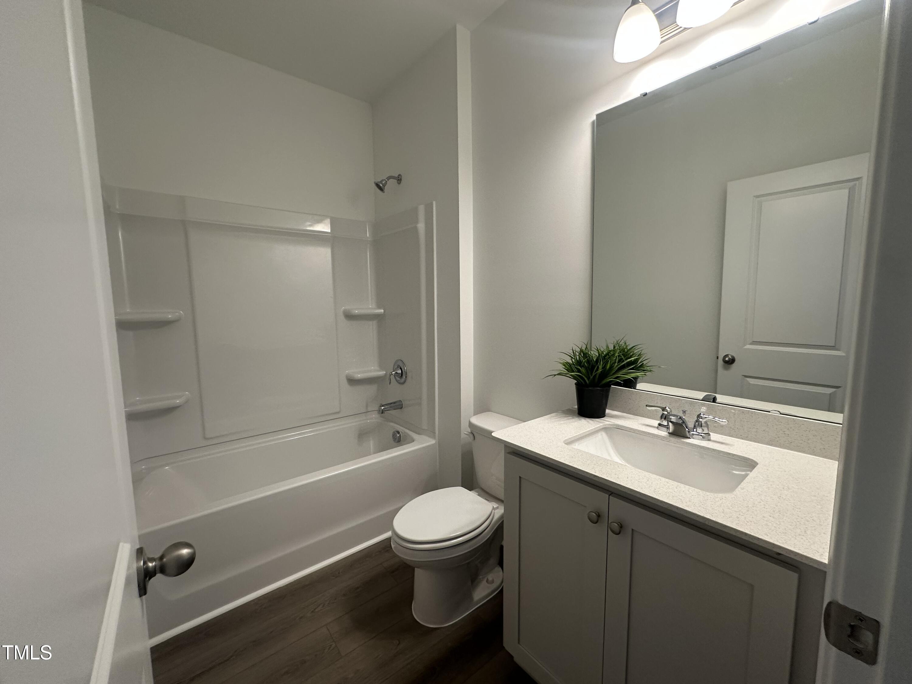 11198 Salers Loop Middlesex, NC 27557 - Photo 23 of 34 a bathroom with a sink toilet and shower