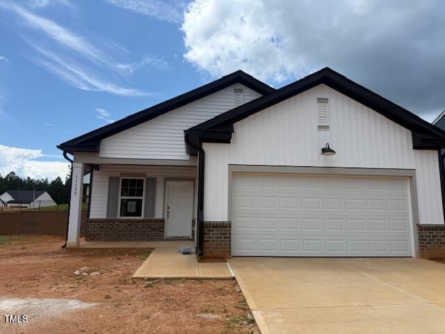 11198 Salers Loop Middlesex, NC 27557 - Photo 3 of 34 a front view of a house with a yard and garage
