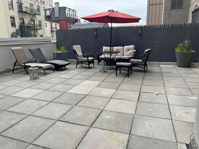 a view of a terrace with seating space