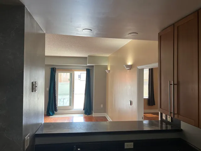 a hallway with mirror and window