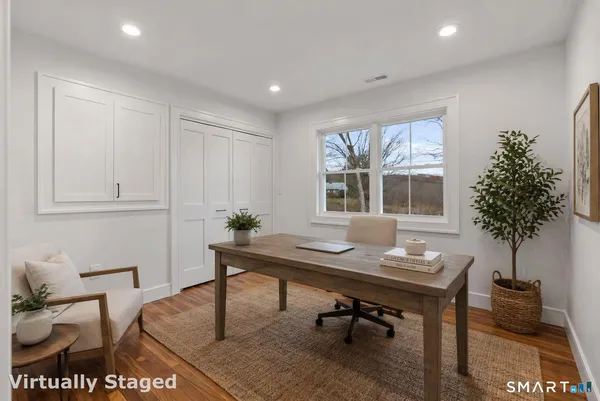 a workspace with furniture and window