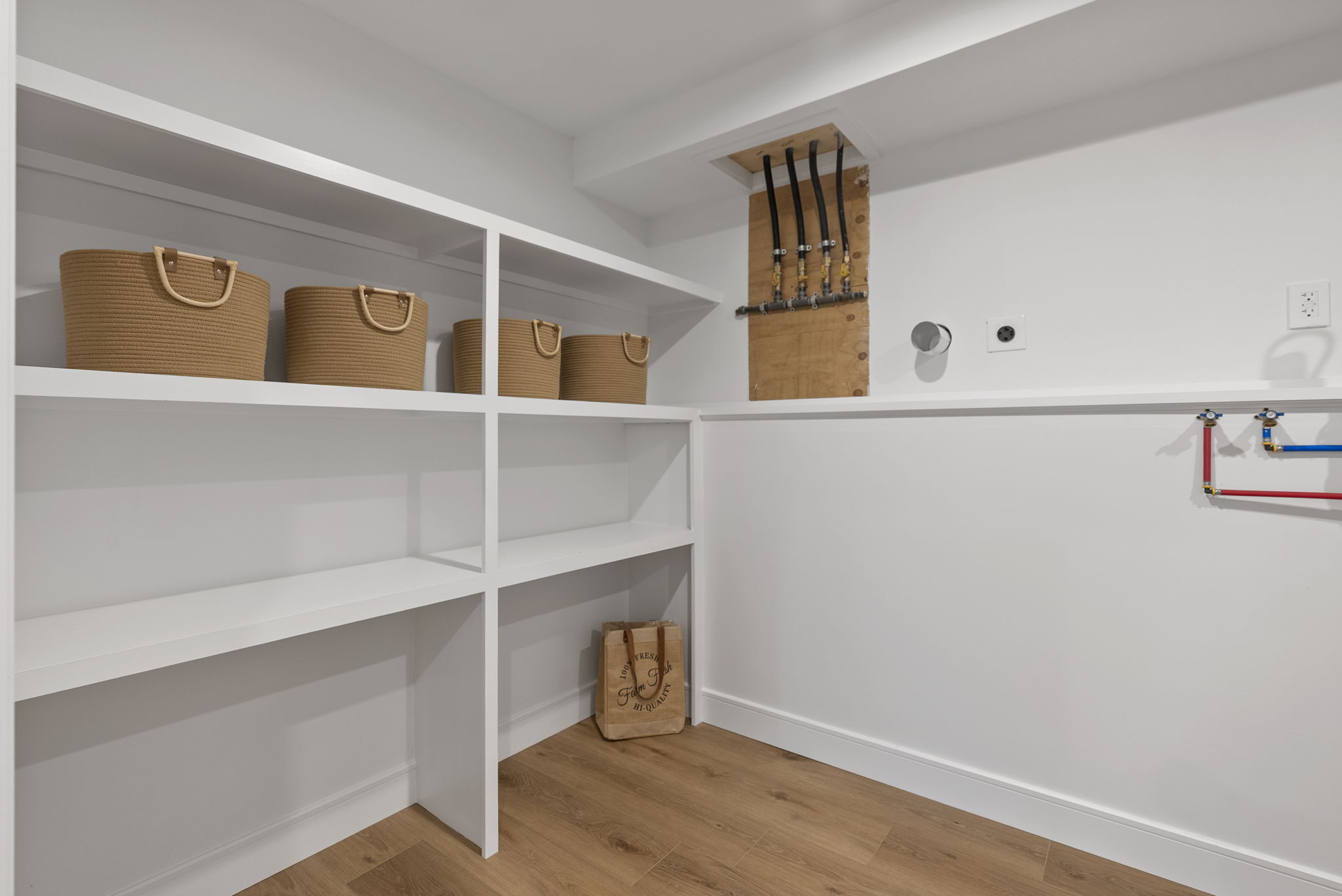 52 Curtis Road Bridgewater, CT 06752 - Photo 20 of 27 Thoughtfully designed for everyday ease, this laundry and pantry combo adds function and convenience, also features a new central vac system, new mechanicals, plumbing and electrical, keeping the home organized and efficient.