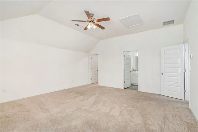 a view of a livingroom with a ceiling fan and window
