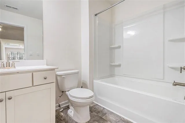 a bathroom with a sink toilet and bathtub