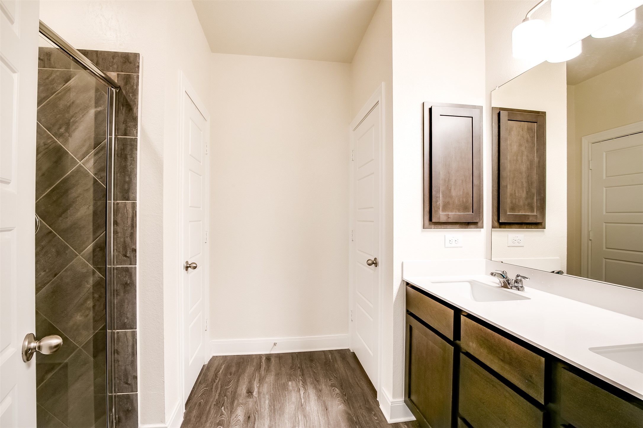 7616 Groundhog Way Austin, TX 78744 - Photo 21 of 34 a bathroom with a sink and a mirror