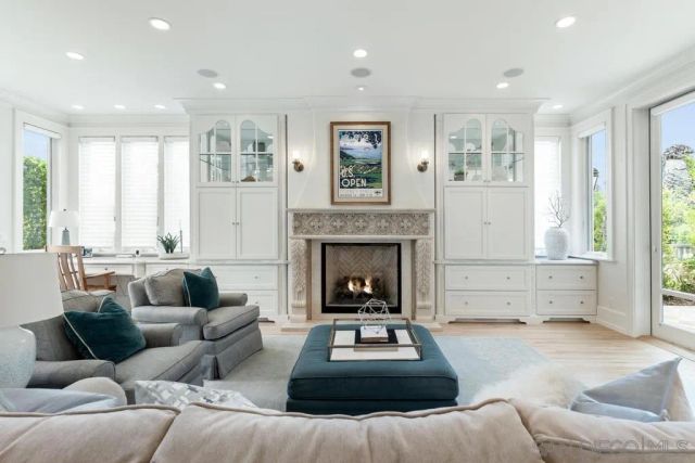 a view of a livingroom with furniture and hardwood floor