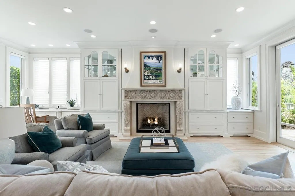 7971 Prospect Place La Jolla, CA 92037 - Photo 11 of 36 a living room with furniture and a fireplace