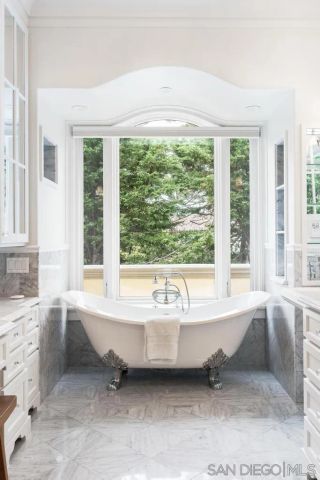 a bedroom with a bed and a cabinets