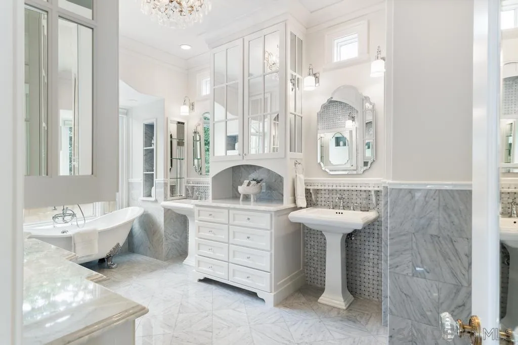 7971 Prospect Place La Jolla, CA 92037 - Photo 22 of 36 a spacious bathroom with a sink mirror and a bathtub