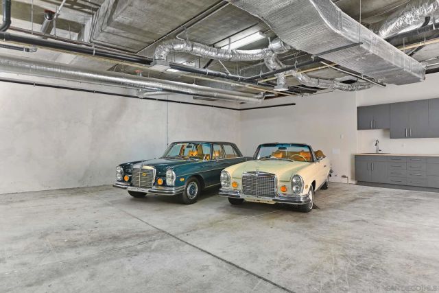 a view of a garage with parked cars