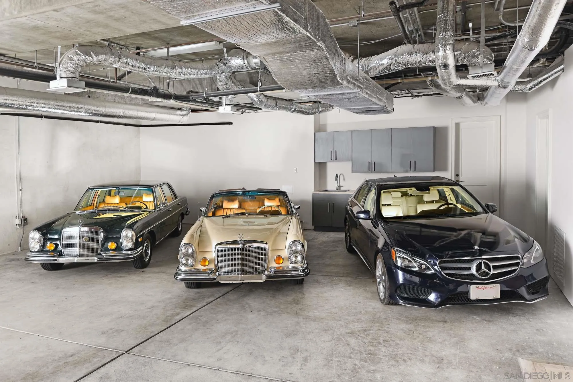 7971 Prospect Place La Jolla, CA 92037 - Photo 28 of 36 a car parked in garage