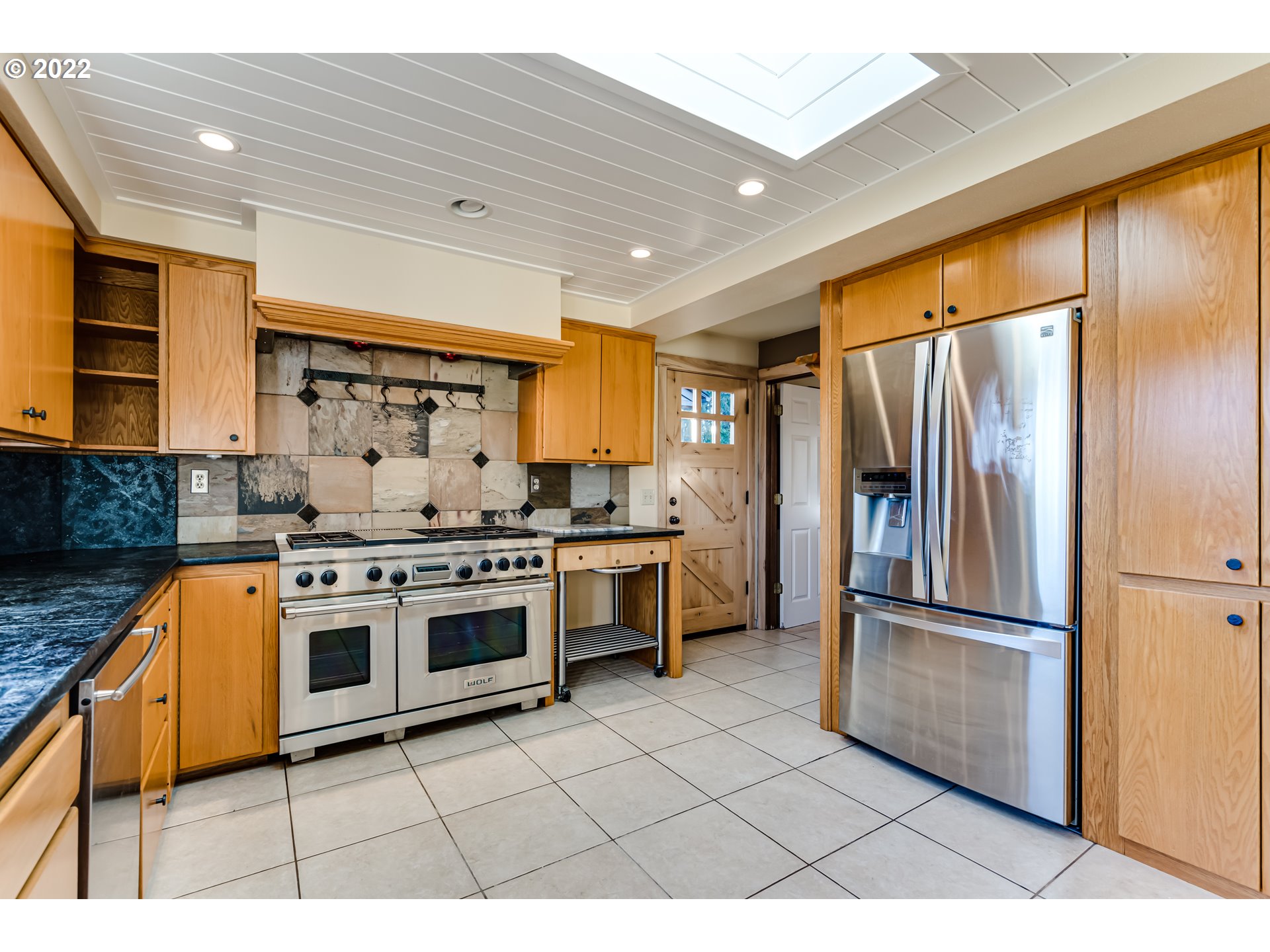 37577 Wheeler Road Dexter, OR 97431 - Photo 8 of 32 a kitchen with stainless steel appliances granite countertop a stove a refrigerator and a refrigerator