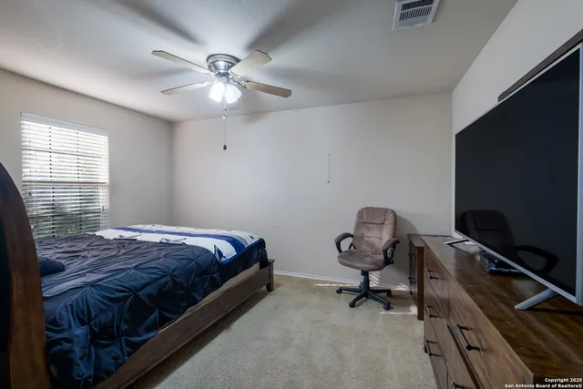 a bedroom with bed and window