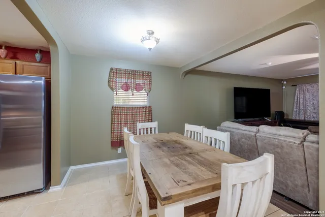 a view of a dining room with furniture
