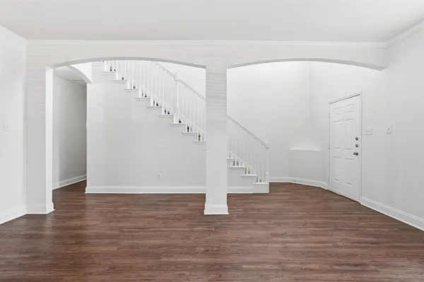 a view of entryway with wooden floor