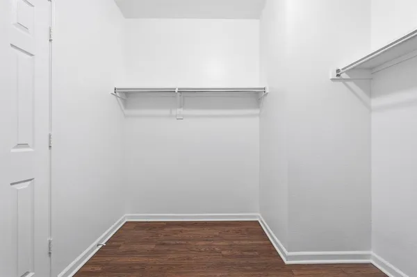 a view of an empty walk in closet