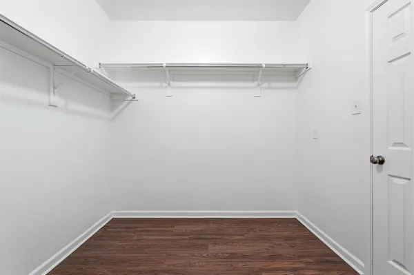 a view of a room with racks on the wall