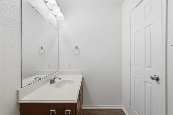 a bathroom with a sink and mirror