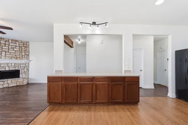 a view of cabinets with wooden floor and staircase