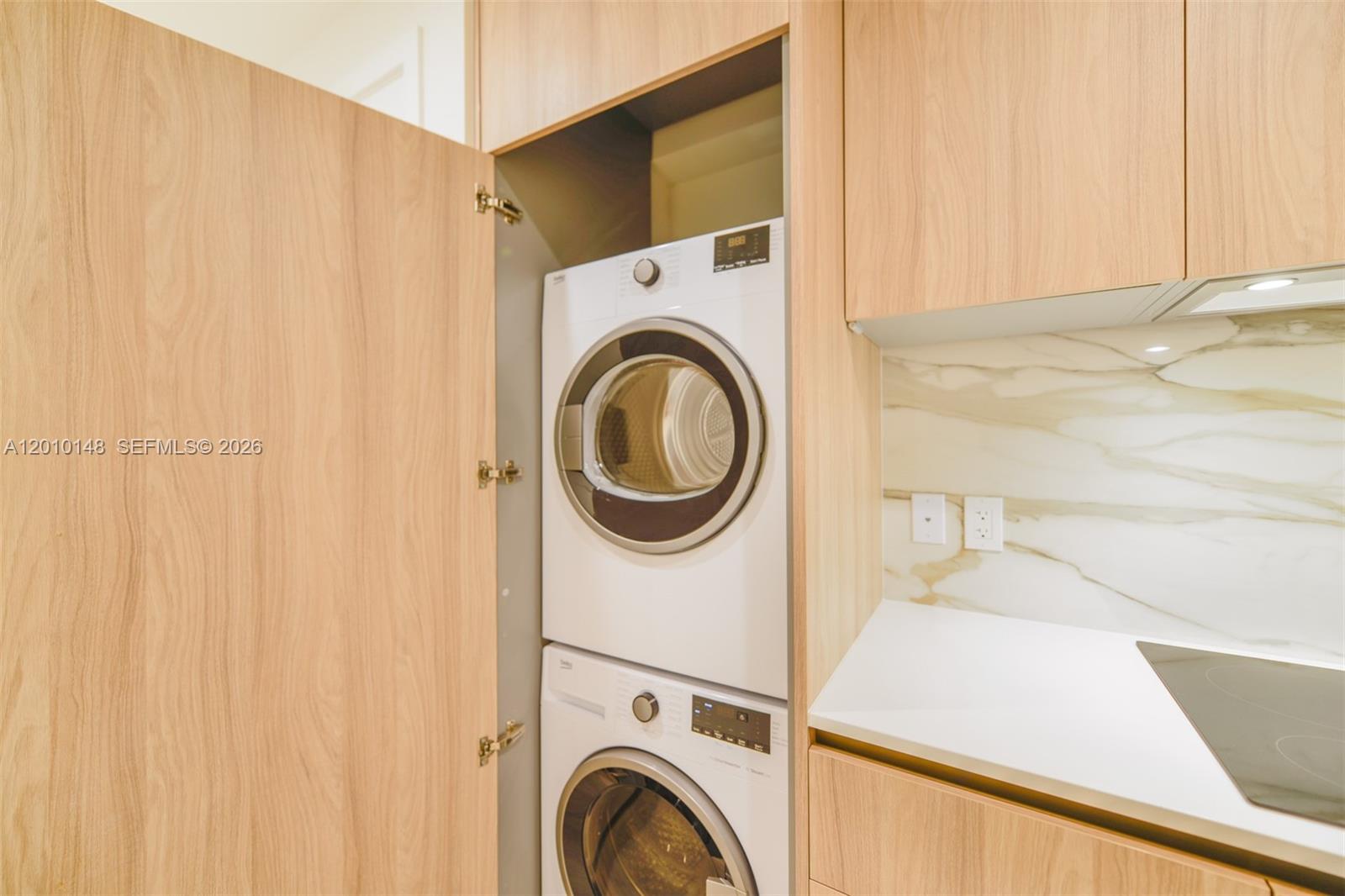 77 Southeast 5th Street, Unit 2604 Miami, FL 33131 - Photo 11 of 47 a utility room with dryer and washer