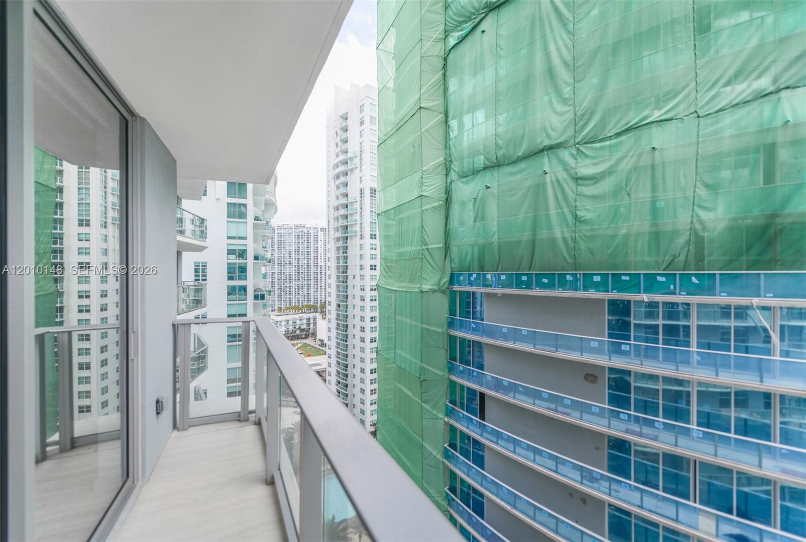 77 Southeast 5th Street, Unit 2604 Miami, FL 33131 - Photo 16 of 47 a view of balcony with a floor to ceiling window and stairs