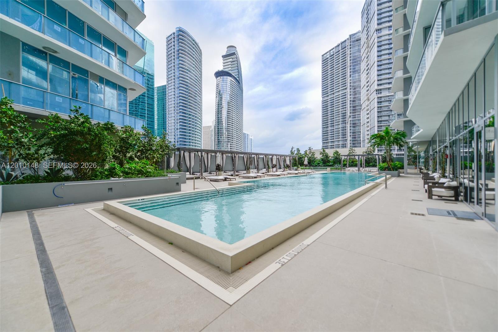 77 Southeast 5th Street, Unit 2604 Miami, FL 33131 - Photo 30 of 47 a view of swimming pool from a balcony