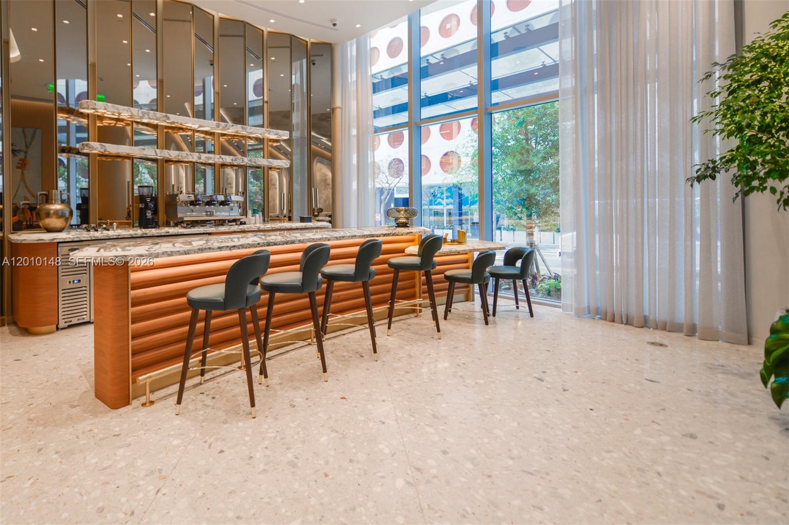 77 Southeast 5th Street, Unit 2604 Miami, FL 33131 - Photo 39 of 47 a view of a chairs and table in the patio