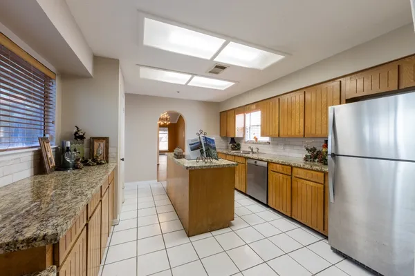 a kitchen that has a sink and a stove