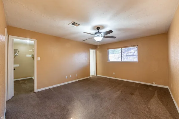 a bathroom with a double vanity sink mirror and bathtub