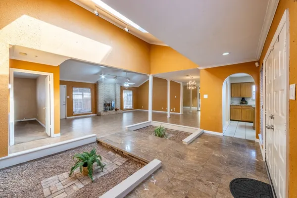 a view of a room with gym equipment and large windows