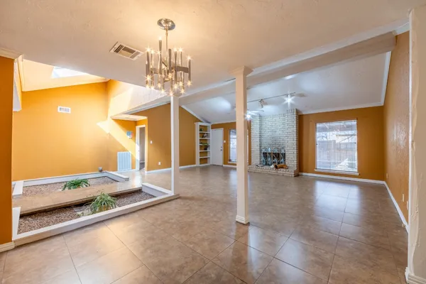 a view of a hallway with a chandelier