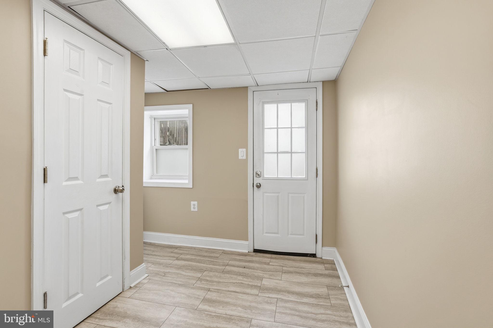 107 West Fort Avenue Baltimore, MD 21230 - Photo 16 of 34 a view of an empty room with wooden floor and a window