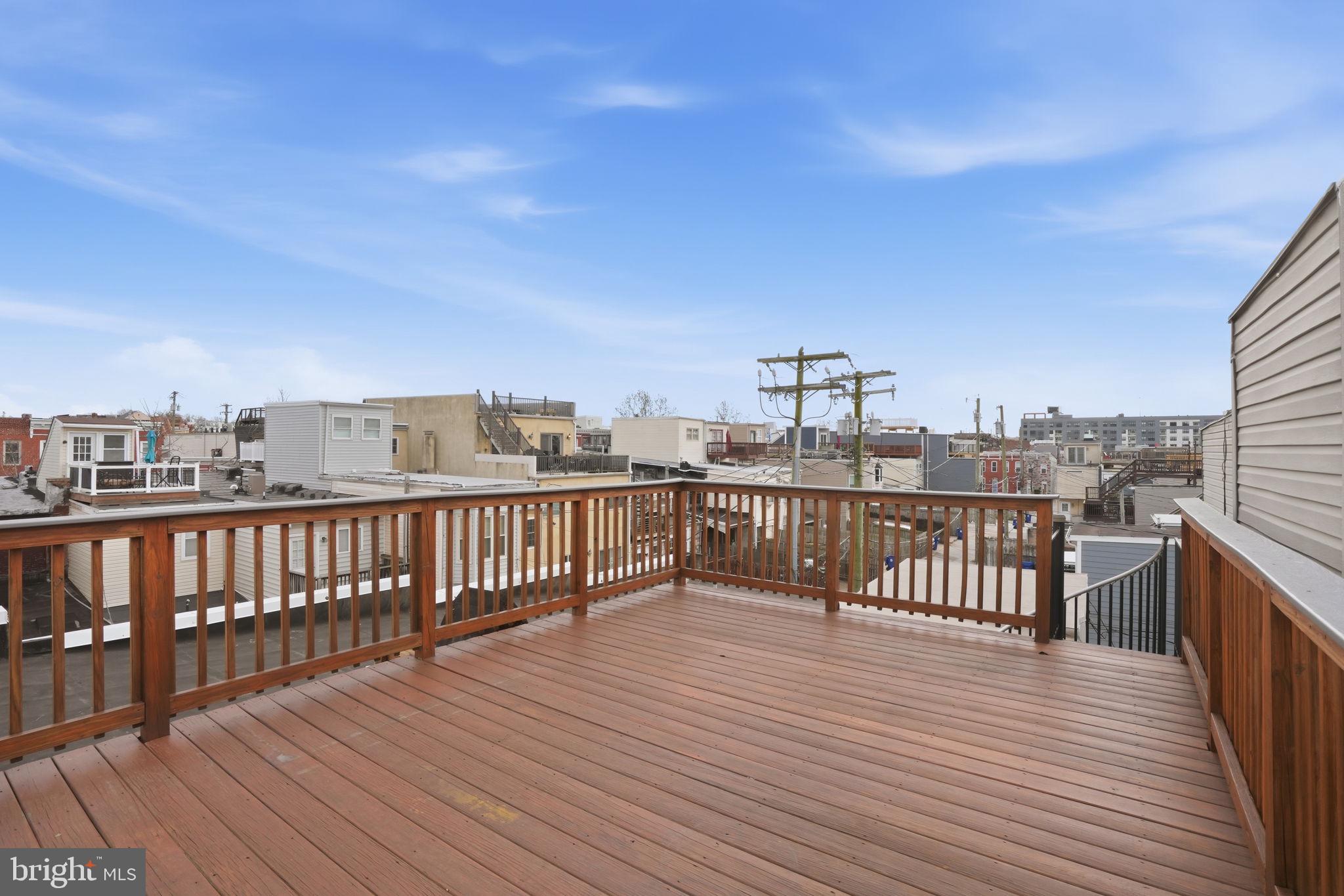 107 West Fort Avenue Baltimore, MD 21230 - Photo 28 of 34 a view of a balcony with wooden floor