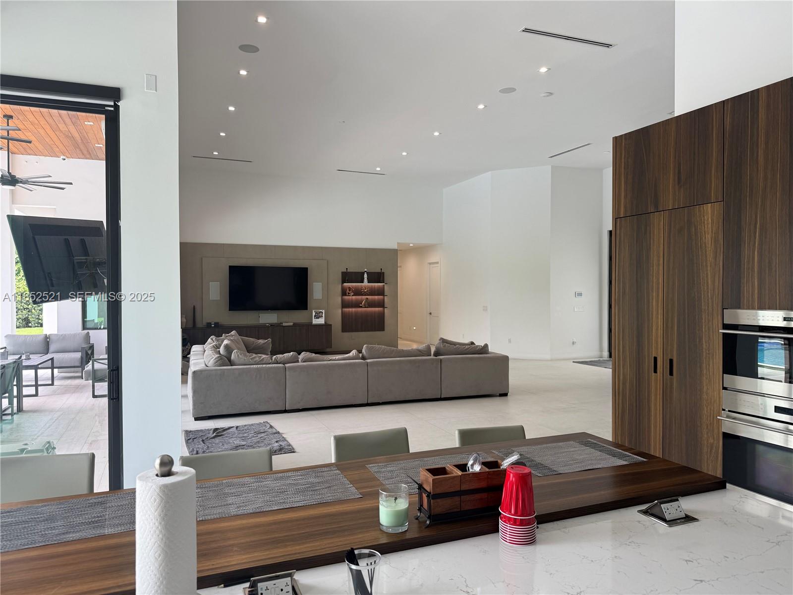 9600 Southwest 66th Street Miami, FL 33173 - Photo 12 of 56 a living room with furniture and a flat screen tv