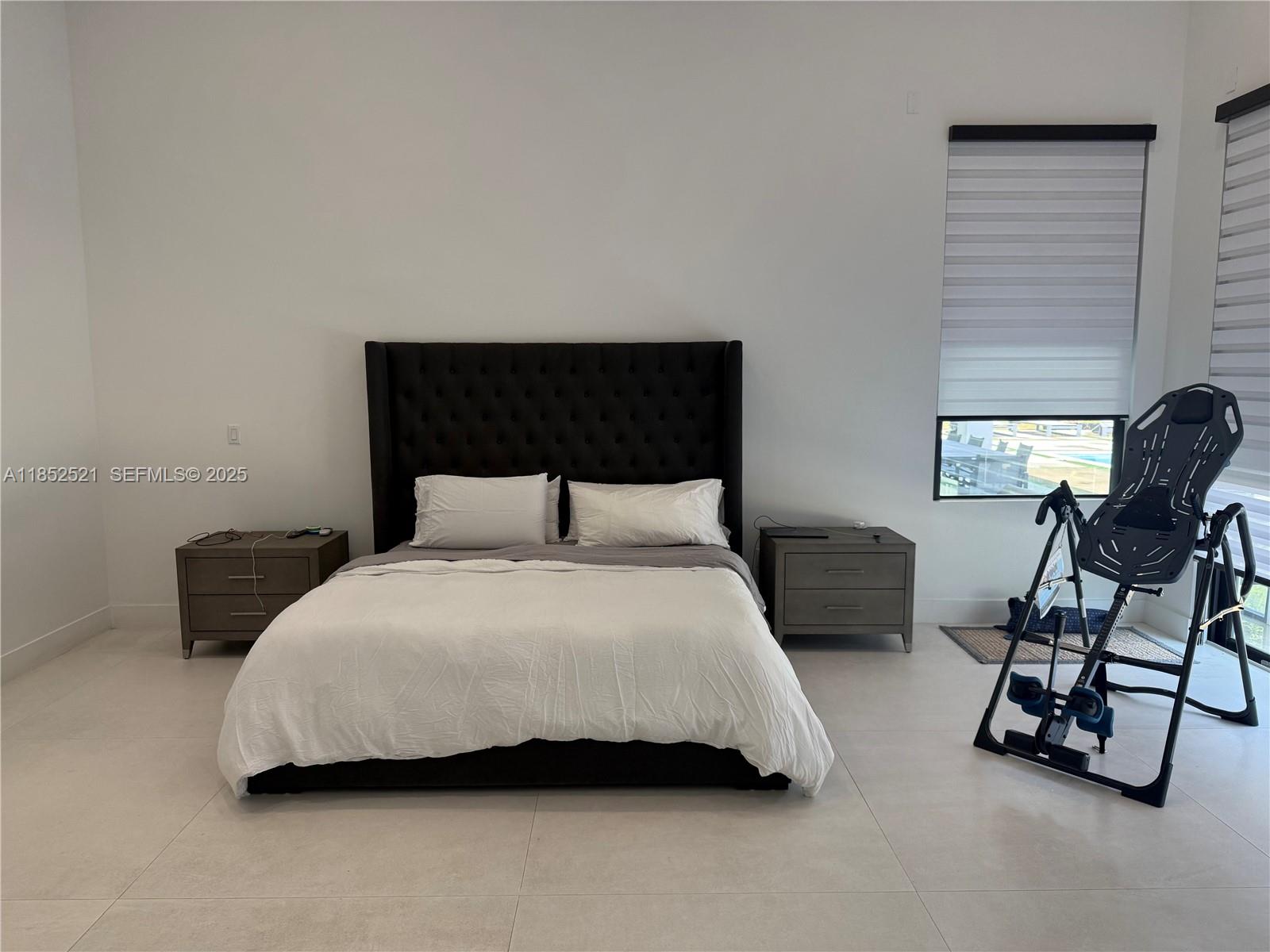 9600 Southwest 66th Street Miami, FL 33173 - Photo 19 of 56 a bedroom with a bed a chair and next to a window