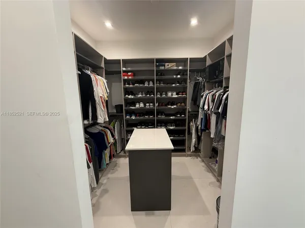 a bathroom with a large tub and shower