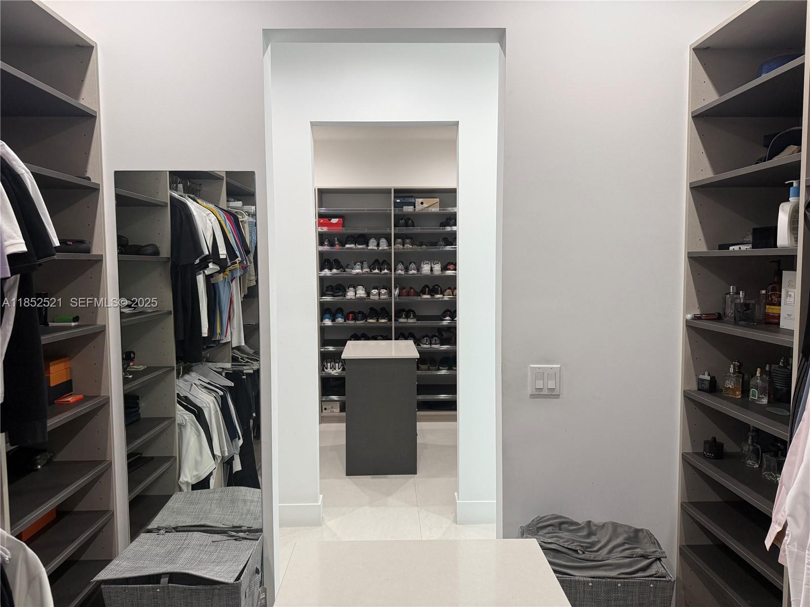 9600 Southwest 66th Street Miami, FL 33173 - Photo 24 of 56 a view of walk in closet with clothes and shoes