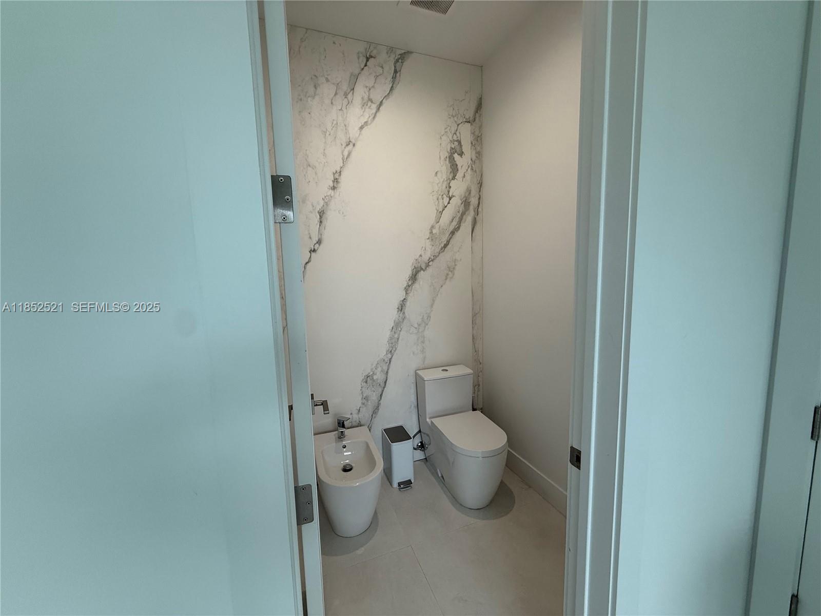 9600 Southwest 66th Street Miami, FL 33173 - Photo 28 of 56 a view of a bathroom with a sink and a toilet