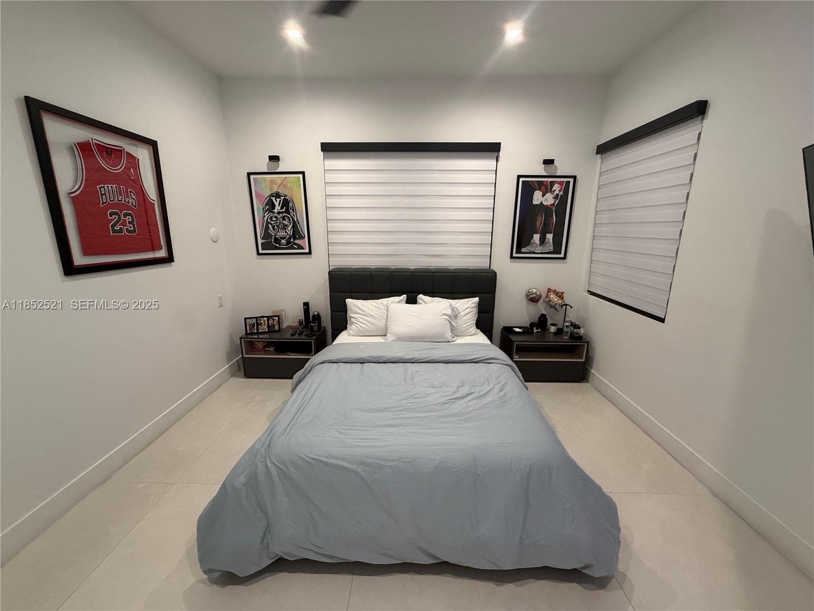 9600 Southwest 66th Street Miami, FL 33173 - Photo 38 of 56 a bedroom with a bed and wall painting