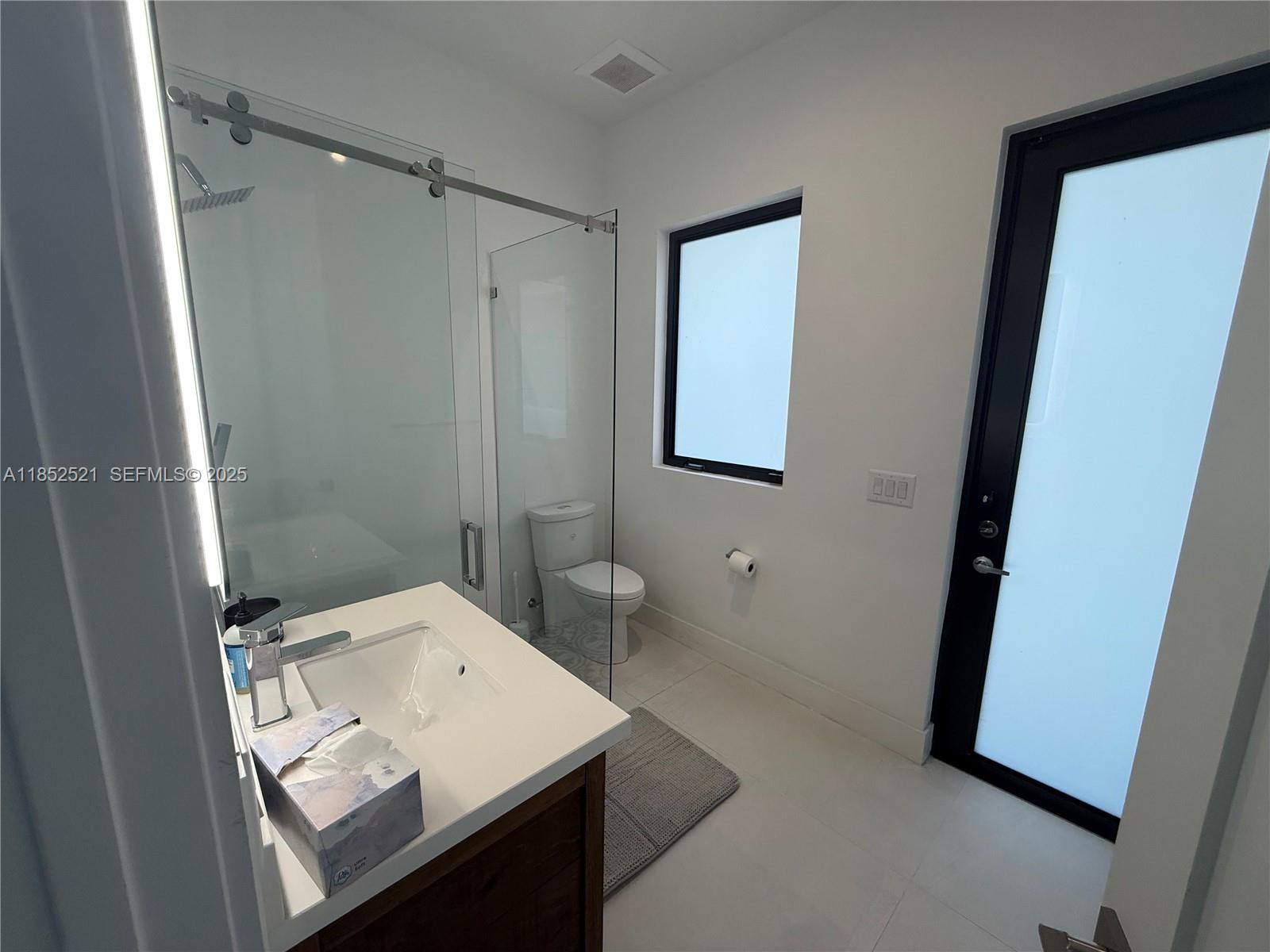 9600 Southwest 66th Street Miami, FL 33173 - Photo 42 of 56 a bathroom with a sink a toilet and shower